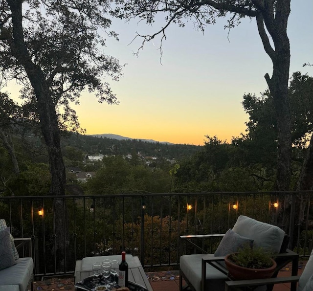 view of patio terrace at dusk