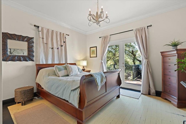 bedroom featuring access to outside, an inviting chandelier, light hardwood / wood-style flooring, crown molding, and french doors