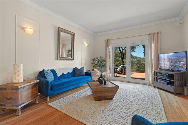 living room featuring french doors, wood-type flooring, and ornamental molding