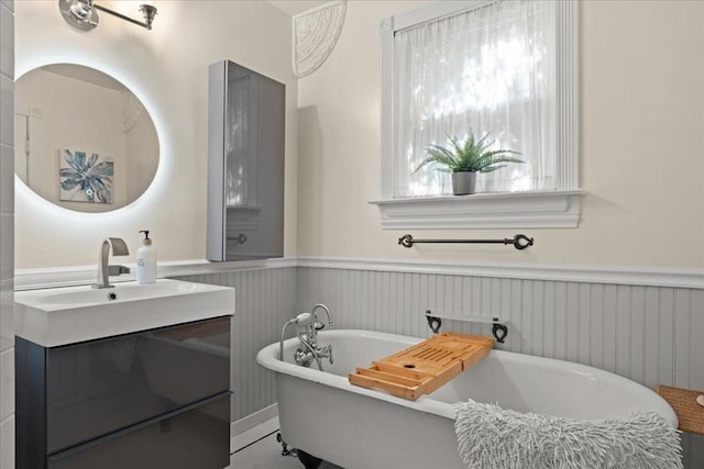 bathroom featuring vanity and a tub to relax in