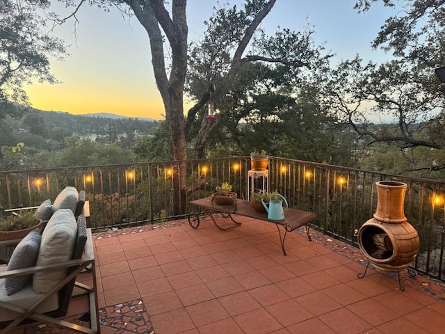 patio terrace at dusk with a mountain view