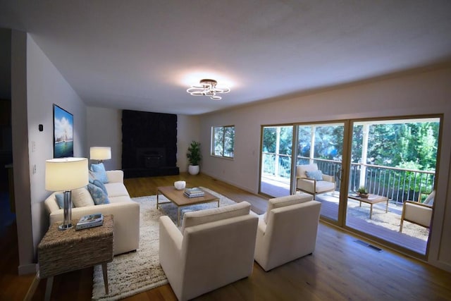 living room featuring hardwood / wood-style floors and a fireplace