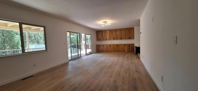 unfurnished living room featuring light hardwood / wood-style flooring