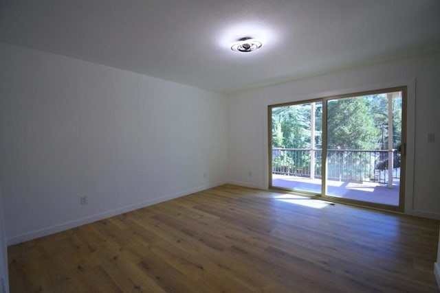 unfurnished room featuring dark hardwood / wood-style floors