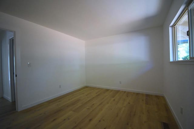 empty room featuring hardwood / wood-style floors