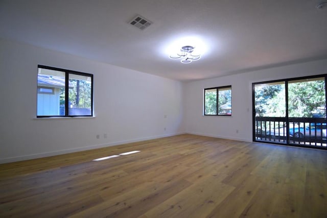 empty room with wood-type flooring