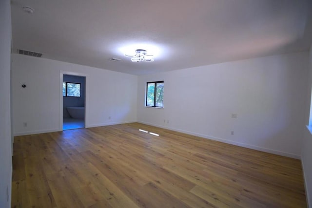 spare room featuring hardwood / wood-style floors