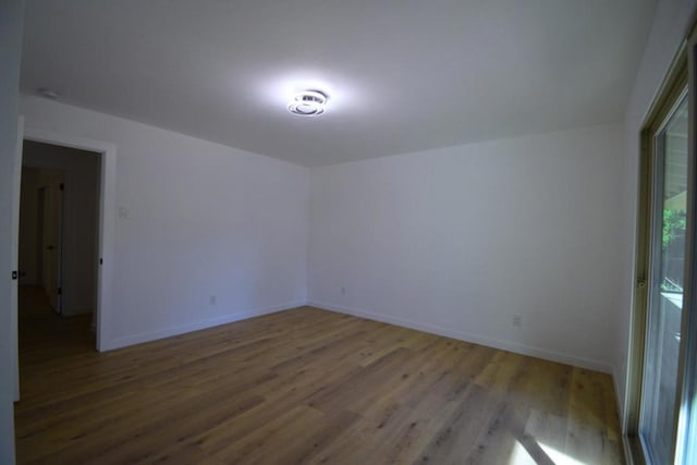 empty room featuring wood-type flooring