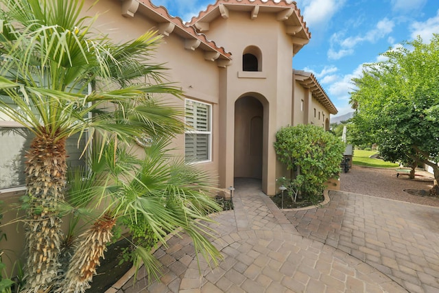 property entrance with a patio