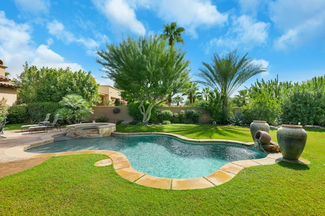 view of swimming pool featuring a lawn, an in ground hot tub, and a patio area