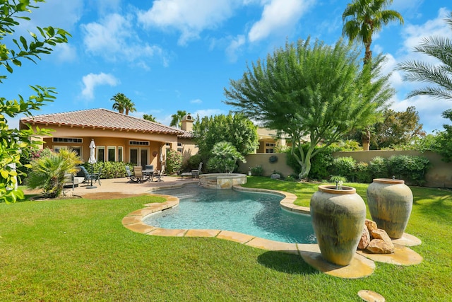 view of swimming pool with a yard and a patio area