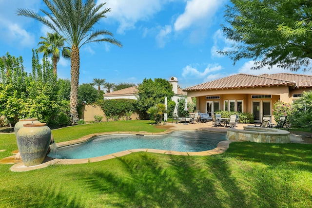 view of swimming pool featuring a yard and a patio