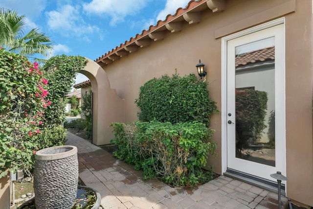 view of side of property featuring a patio