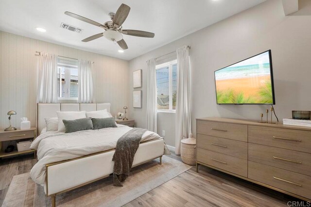 bedroom featuring ceiling fan and light hardwood / wood-style flooring