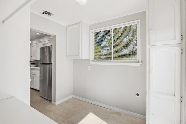 view of tiled spare room