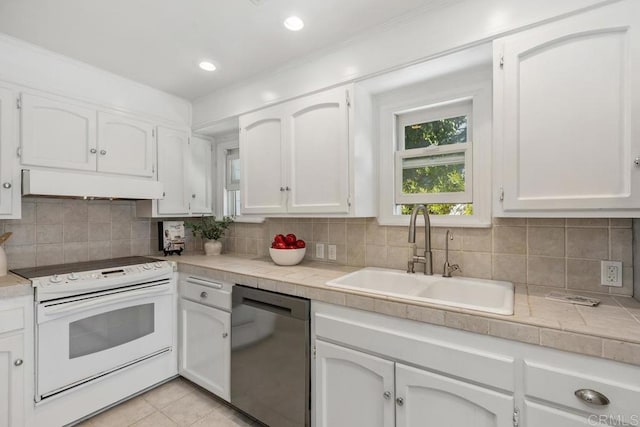 kitchen featuring dishwasher, sink, white cabinets, white range with electric cooktop, and premium range hood