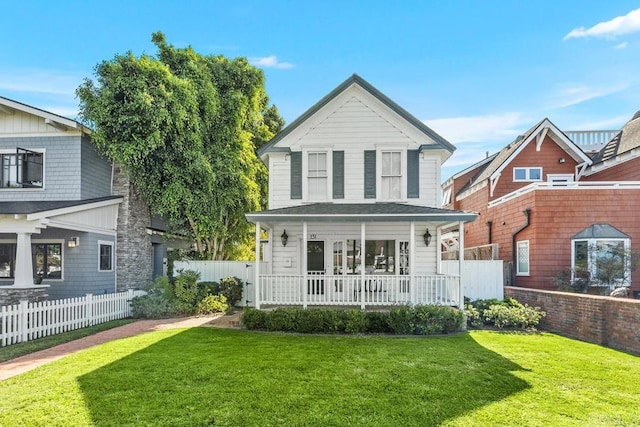 front facade featuring a porch and a front lawn