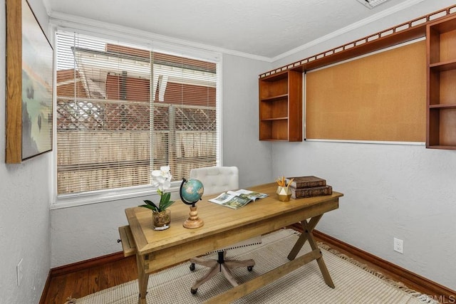 office featuring crown molding and hardwood / wood-style flooring