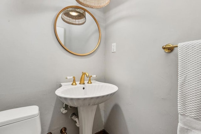 bathroom with toilet and sink