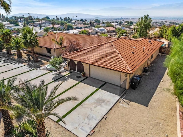 birds eye view of property with a mountain view