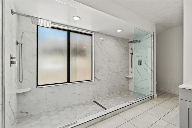 bathroom featuring vanity and tiled shower