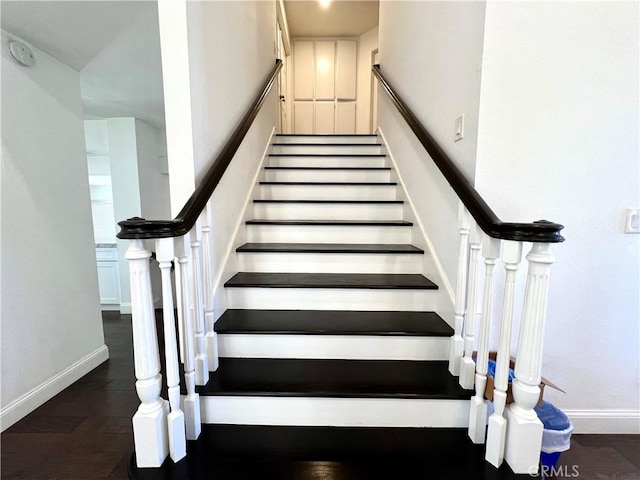 stairway with hardwood / wood-style flooring