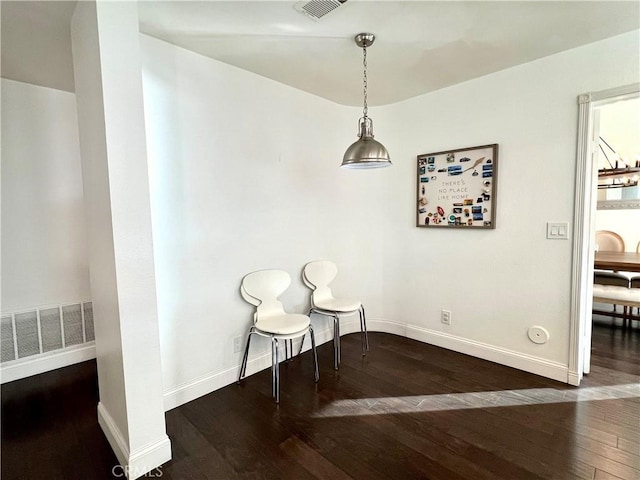 sitting room with dark hardwood / wood-style flooring