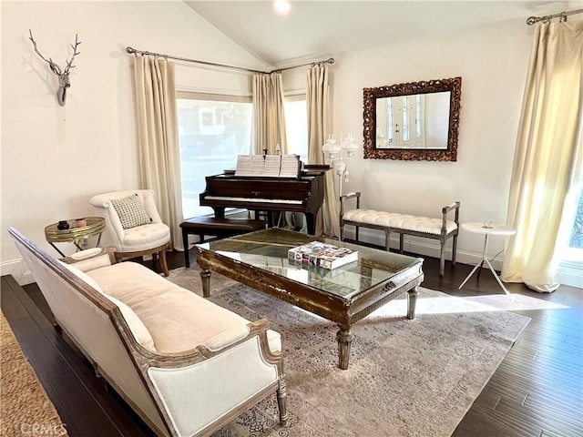 sitting room with vaulted ceiling and dark hardwood / wood-style flooring