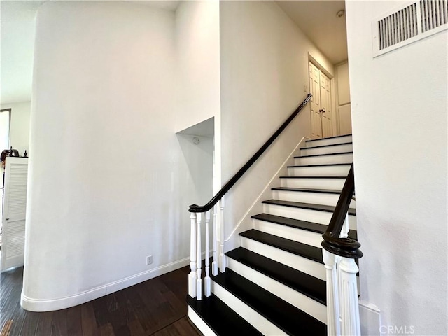 stairway featuring hardwood / wood-style floors