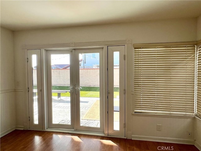 entryway featuring french doors and hardwood / wood-style flooring