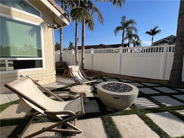 view of patio / terrace with an outdoor fire pit