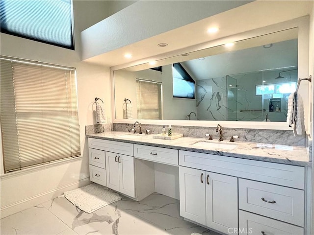 bathroom featuring vanity and bath / shower combo with glass door