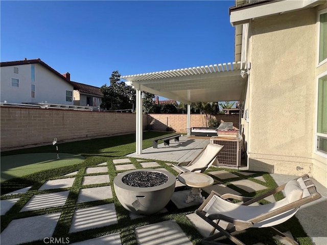 view of patio / terrace with a fire pit and a pergola