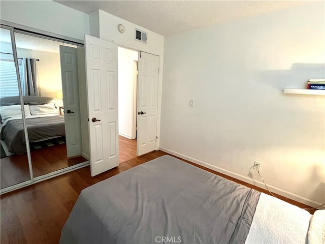 bedroom featuring a closet and hardwood / wood-style floors