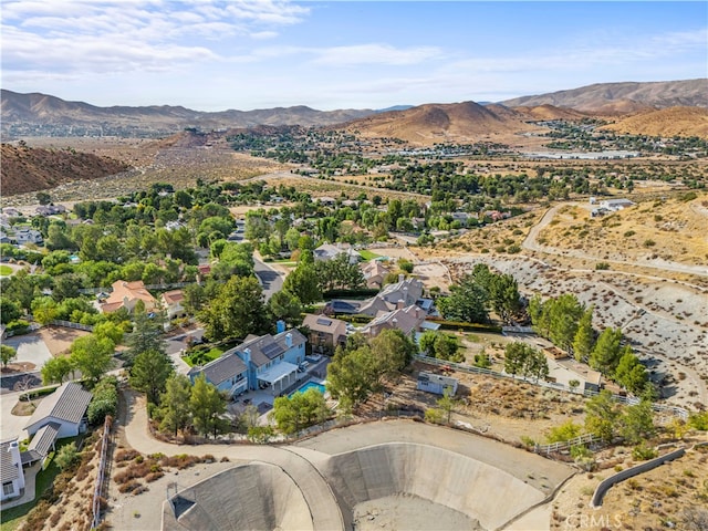 birds eye view of property with a mountain view