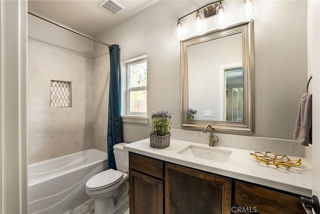 full bathroom featuring vanity, toilet, and shower / bath combo with shower curtain