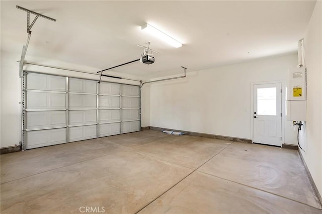 garage featuring a garage door opener and water heater