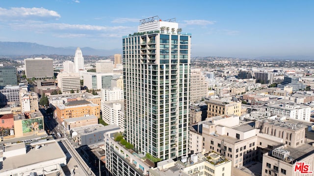 property's view of city featuring a mountain view