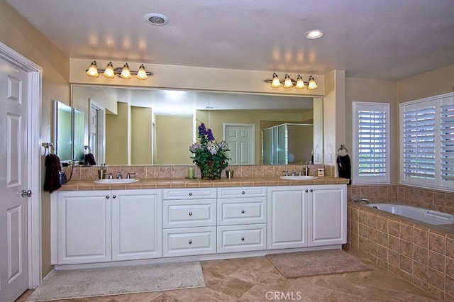 bathroom with vanity, separate shower and tub, and tile patterned flooring