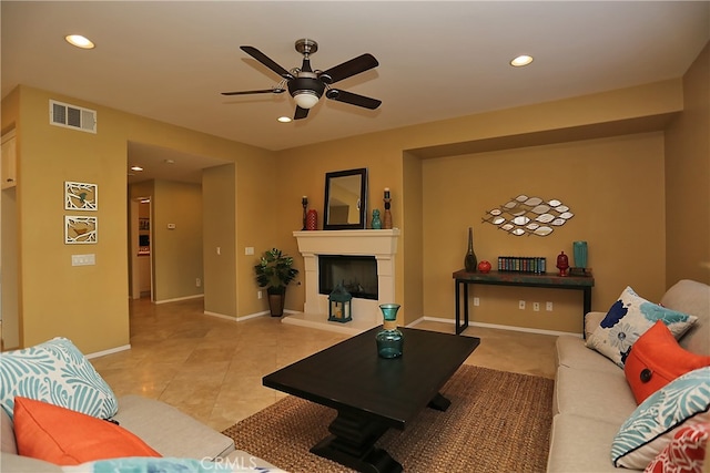 tiled living room with ceiling fan