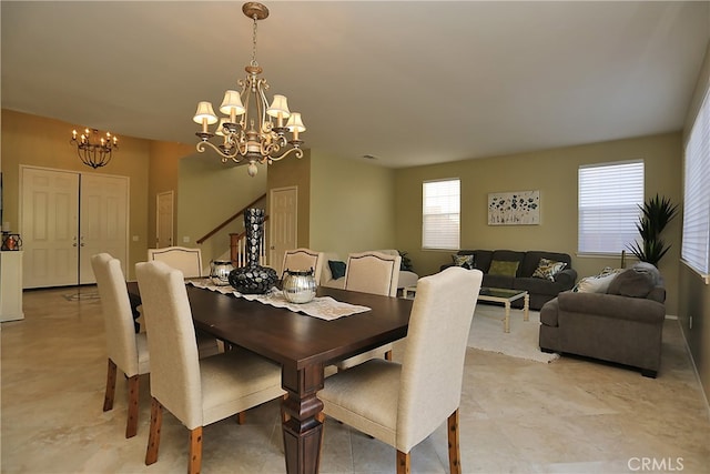 dining space with a notable chandelier