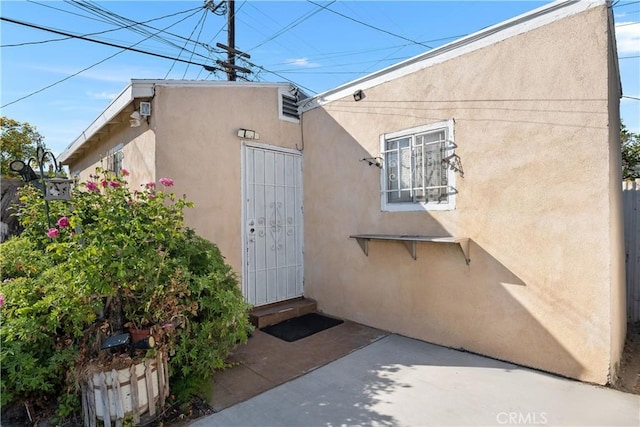 3959 Denker Ave, Los Angeles, CA 90062 - property entrance featuring stucco siding and a patio