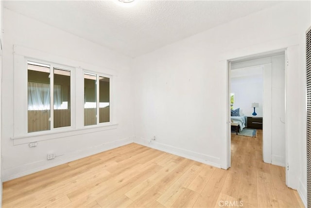 3959 Denker Ave, Los Angeles, CA 90062 - spare room with light wood-style floors and baseboards