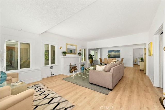 3959 Denker Ave, Los Angeles, CA 90062 - living area with light wood finished floors and a textured ceiling