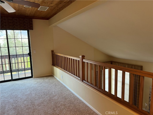 carpeted spare room with ceiling fan, wooden ceiling, and vaulted ceiling