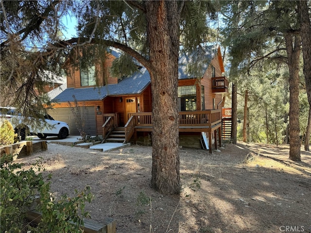 view of front of house with a deck and a garage