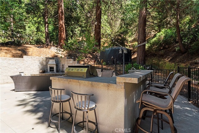 view of patio / terrace featuring area for grilling and a grill