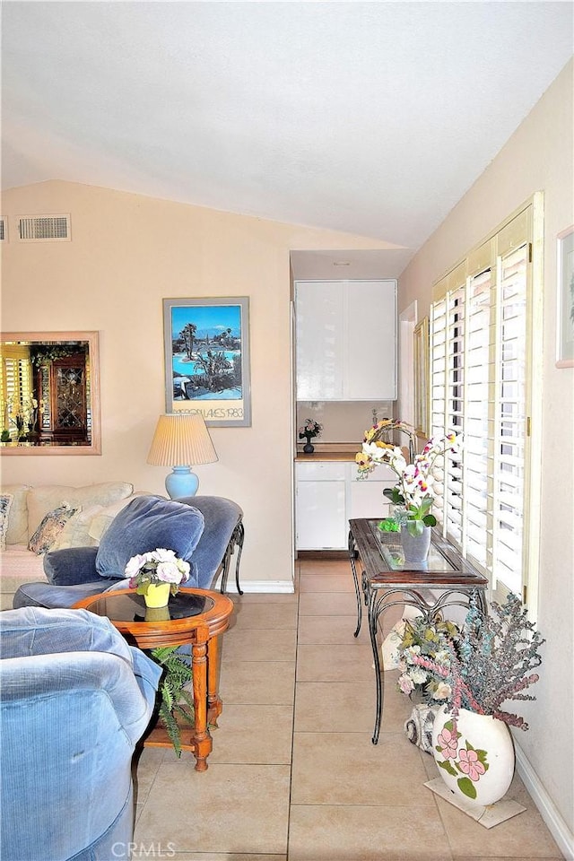 tiled living room with vaulted ceiling