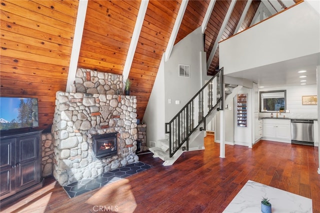 living room with wood ceiling, beam ceiling, dark hardwood / wood-style floors, and high vaulted ceiling