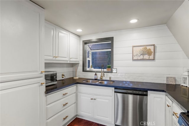 kitchen featuring white cabinets, appliances with stainless steel finishes, dark hardwood / wood-style floors, and sink